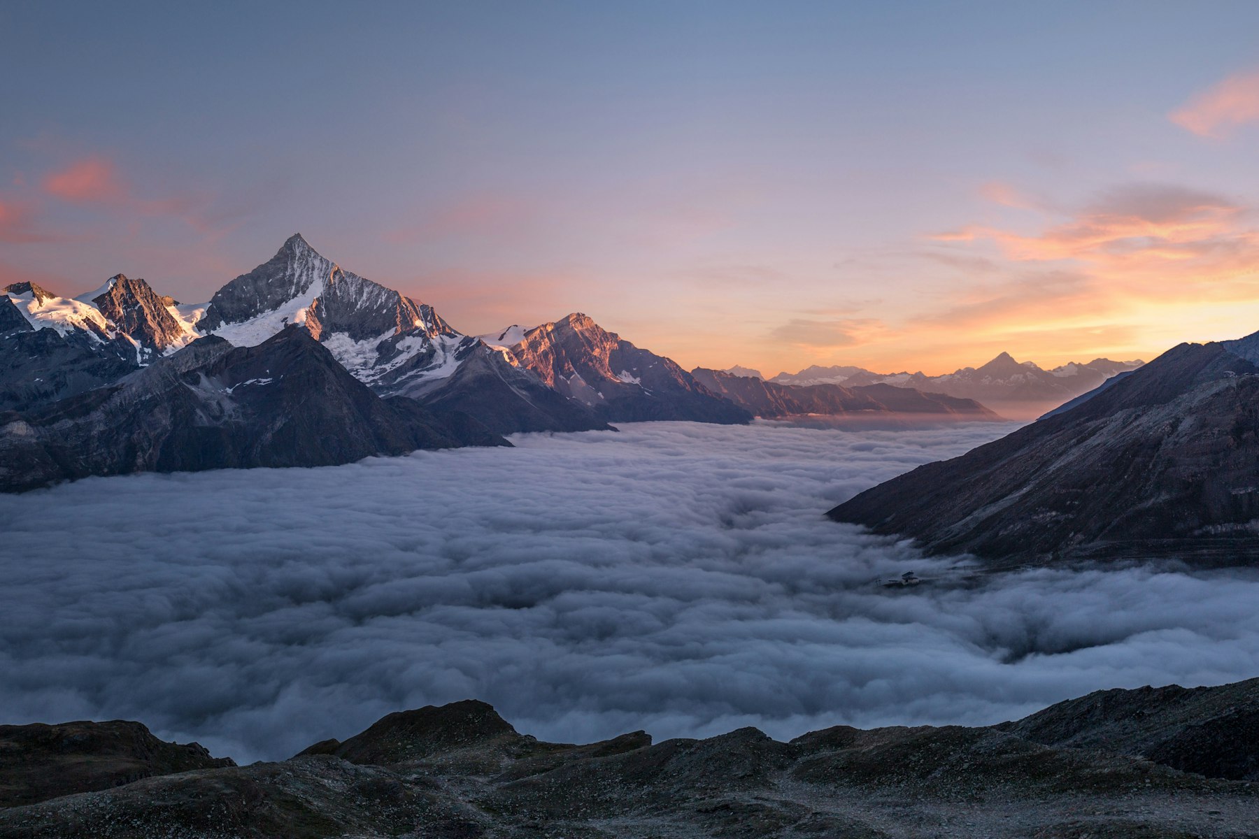 A glaciated summit under a clear sky