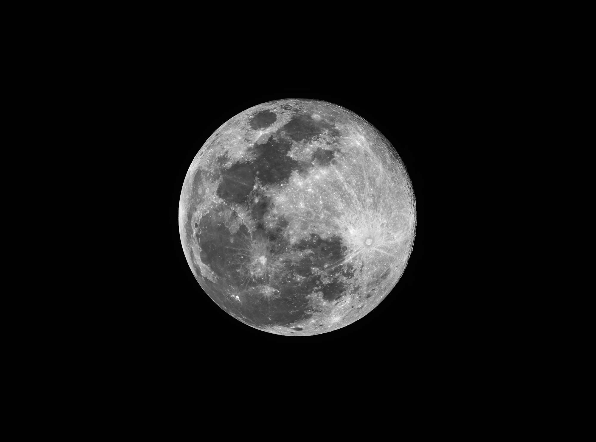 Full moon with visible craters against a black sky